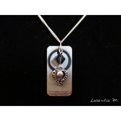 Pendant necklace with Swarovski crystal beads black ring and silver heart on concrete pad