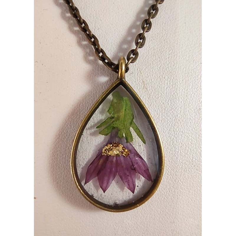 Bronze pendant necklace with inclusion of purple flower resin