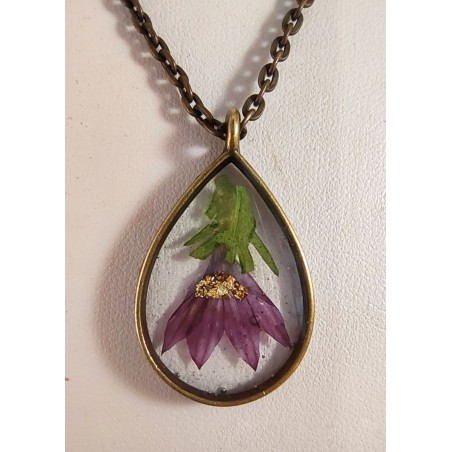 Bronze pendant necklace with inclusion of purple flower resin