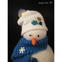 Snowman in sock filled with rice, blue hand knitted scarf, buttons