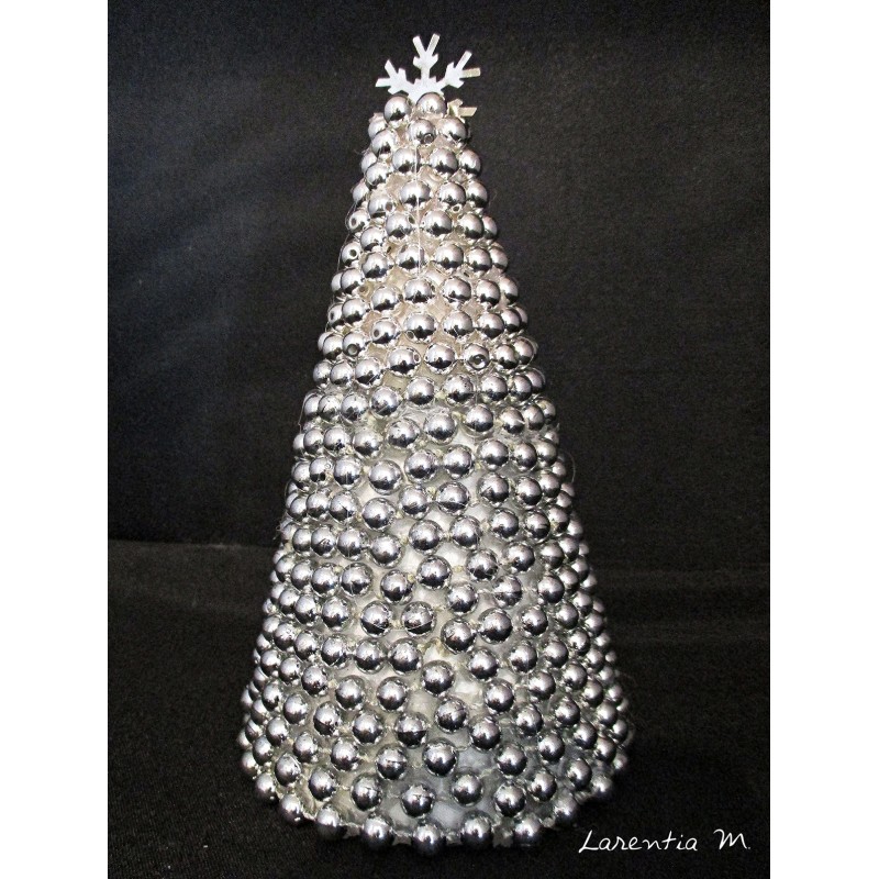 Polystyrene fir covered with silver beads and metal flake