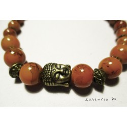 Bracelet perles pierres orangées, tête  bouddha vieil or