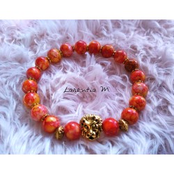 Bracelet perles verre 8mm orangées mouchetées, tête de lion dorée - Elastique