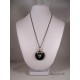 Silver Pendant Necklace "Skull" with metal bead silver pedestal of black painted steel and concrete round ring