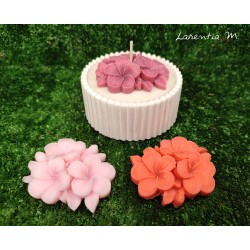 White ceramic pot with vegetable candle and flower "overcandle"