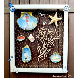 Painting of painted shells, coral, starfish, white wooden frame