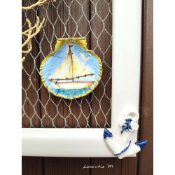 Painting of painted shells, coral, starfish, white wooden frame