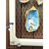 Painting of painted shells, coral, starfish, white wooden frame