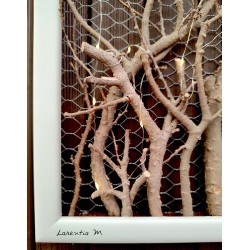 White frame with illuminated branches and white ceramic bird