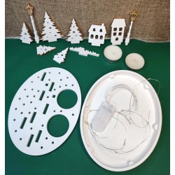 Christmas village with candles and fairy lights