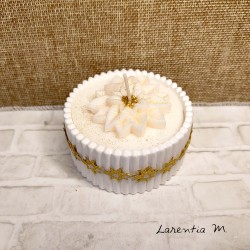 White ceramic pot with a poinsettia vegetable wax candle and "over-candle"
