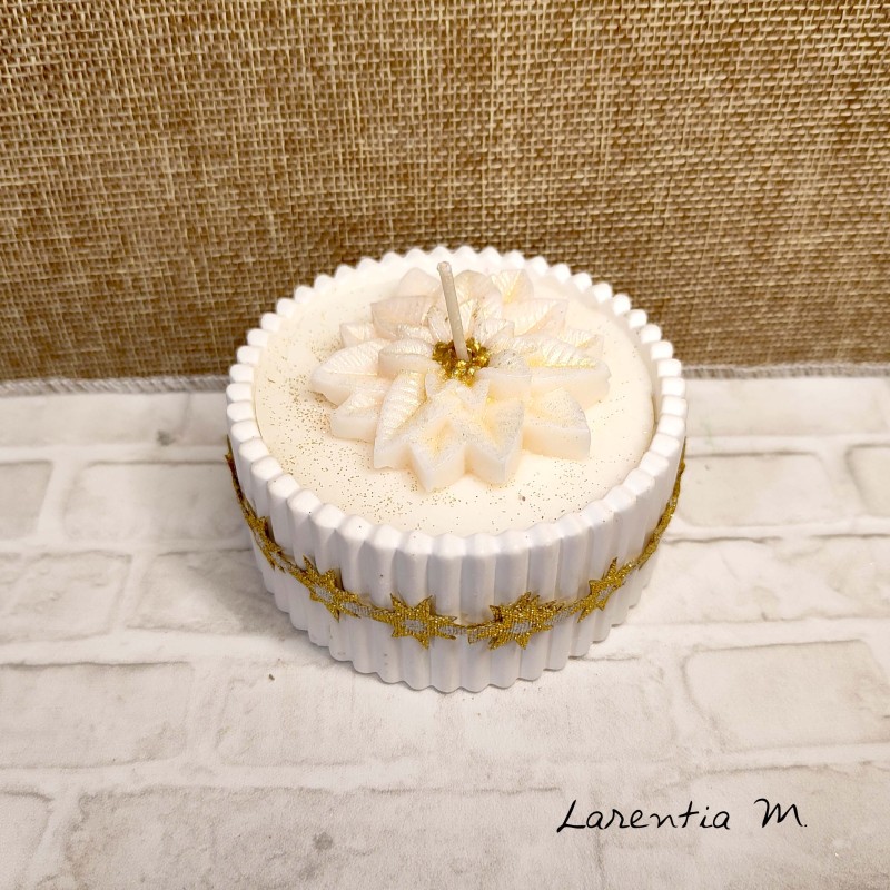 White ceramic pot with a poinsettia vegetable wax candle and "over-candle"