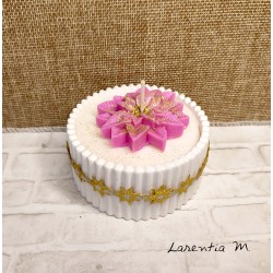 White ceramic pot with a poinsettia vegetable wax candle and "over-candle"