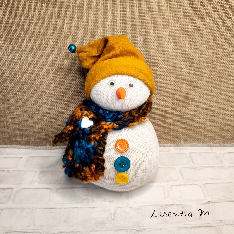 Snowman in sock filled with rice, hand knitted scarf, buttons