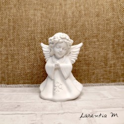 White angel standing in prayer, ceramic