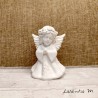 White angel standing in prayer, ceramic