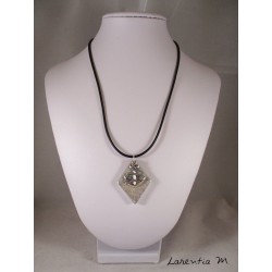 Pendant necklace zodiac sign "Sagittarius" with white shamballa pearl diamond on concrete pedestal decorated grey