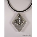 Pendant necklace zodiac sign "Sagittarius" with white shamballa pearl diamond on concrete pedestal decorated grey