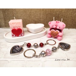 Candle with 2 pink teddy bears holding a heart