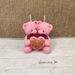 Candle with 2 pink teddy bears holding a heart