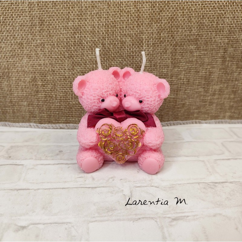 Candle with 2 pink teddy bears holding a heart