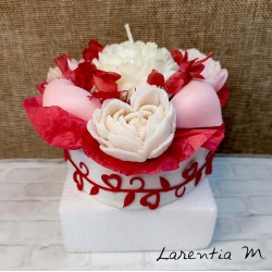 Bouquet of flower candles in a box with dried flowers and ribbon