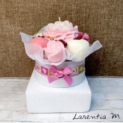Bouquet of flower candles in a box with dried flowers and ribbon