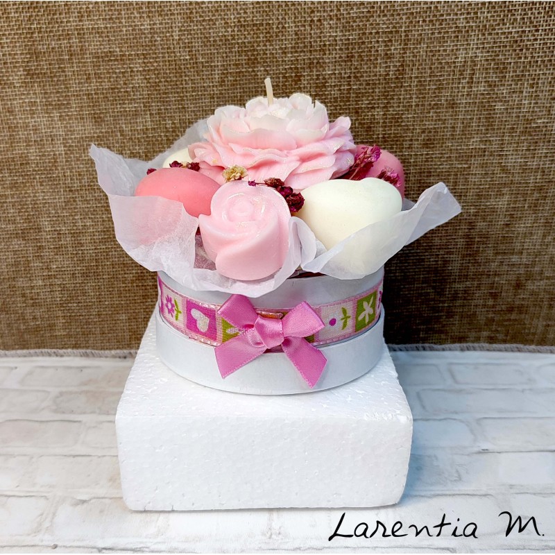 Bouquet of flower candles in a box with dried flowers and ribbon