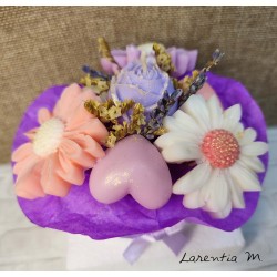 Bouquet of flower candles in a box with dried flowers and ribbon