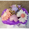 Bouquet of flower candles in a box with dried flowers and ribbon