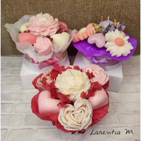 Bouquet of flower candles in a box with dried flowers and ribbon