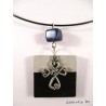 Collier ras de cou noir avec rond béton noir et soleil argenté