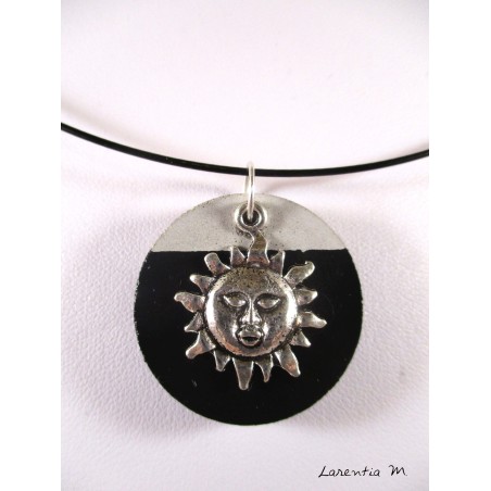 Black necklace with round black concrete and silver sun