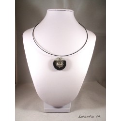 Black necklace with round black concrete and silver sun