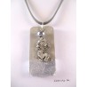 A pendant silver dragon hanging from a crystal pearl gray Bohemia. The cord is gray suede and measures about 40 cm.