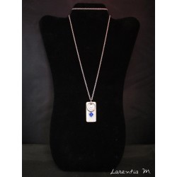 Necklace with Swarovski crystal ring and blue beads on concrete pad