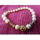 Ivory pearl bracelet and golden lion head