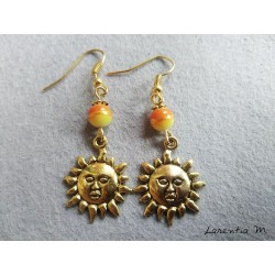 Orange and yellow pearl earrings with golden sun