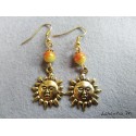 Orange and yellow pearl earrings with golden sun