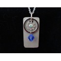 Necklace with Swarovski crystal ring and blue beads on concrete pad