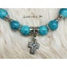 Bracelet 8mm turquoise glass beads, cross and silver beads, elastic