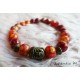8mm orange and rust glass beads bracelet, old bronze Buddha head, elastic