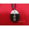 Pendant Necklace "Love" with grey waxed pearl on oval concrete pad painted black