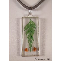 Silver and transparent resin pendant with fern and red flowers, gray suede cord