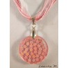 Resin pendant necklace with glitter and pink flowers, pink ribbon and cords