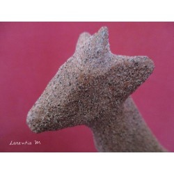 Giraffe paper mache covered with a brown granite sand texture